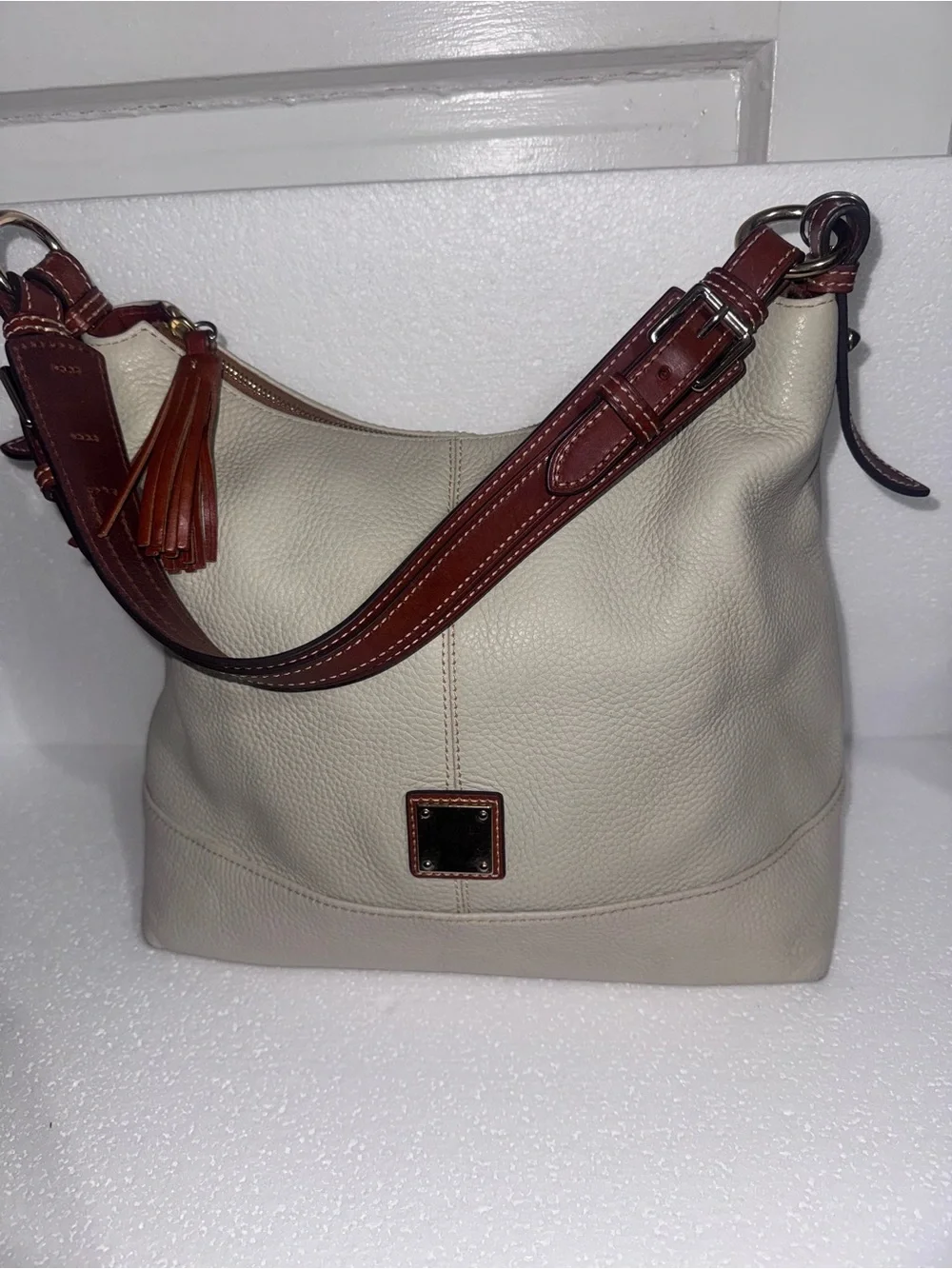 Dooney & Bourke Cream Leather Hobo with Brown Trim and Tassel